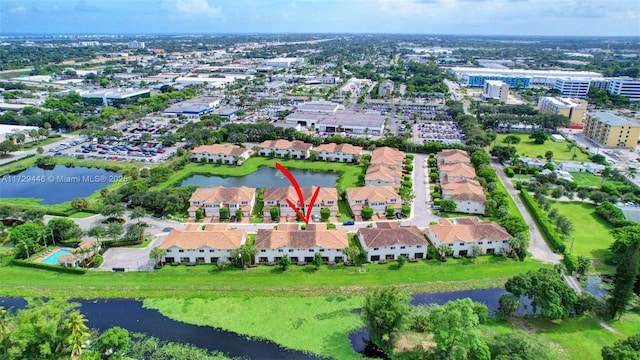 birds eye view of property with a water view