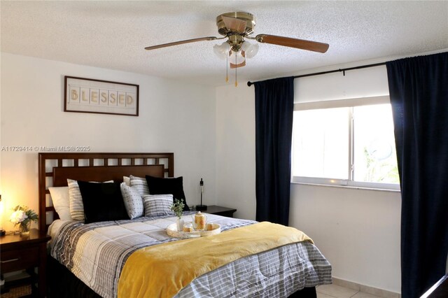 bedroom featuring a textured ceiling and ceiling fan