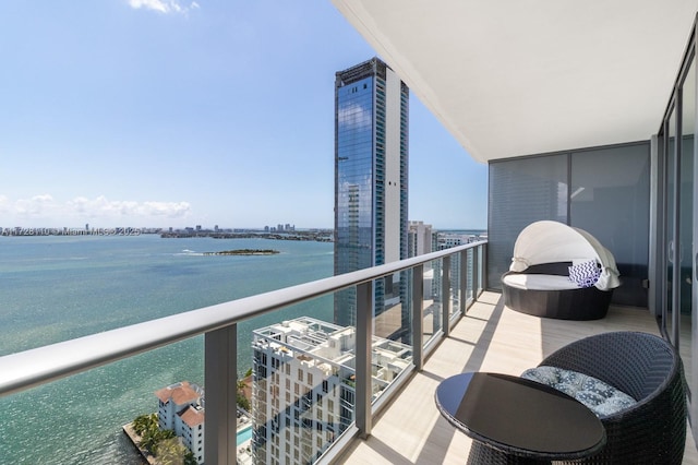 balcony featuring a water view