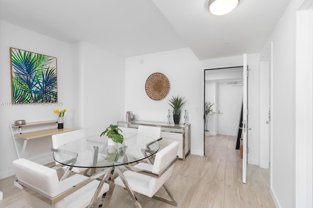 dining space featuring light hardwood / wood-style floors