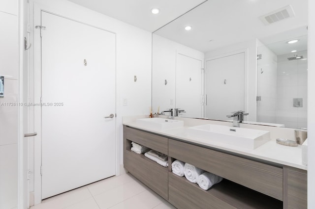 bathroom with vanity, tile patterned flooring, and an enclosed shower