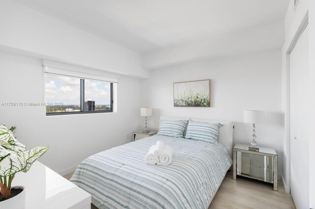 bedroom with light hardwood / wood-style floors