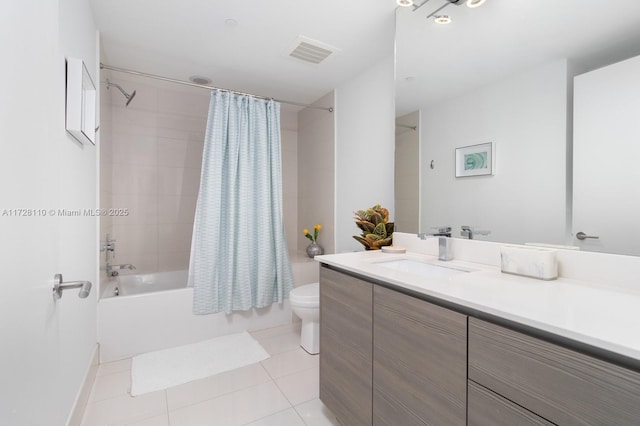 full bathroom featuring tile patterned floors, vanity, toilet, and shower / tub combo with curtain