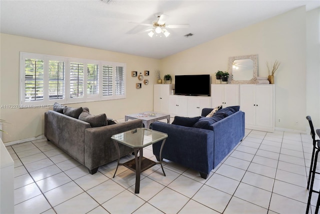 tiled living room with ceiling fan and vaulted ceiling