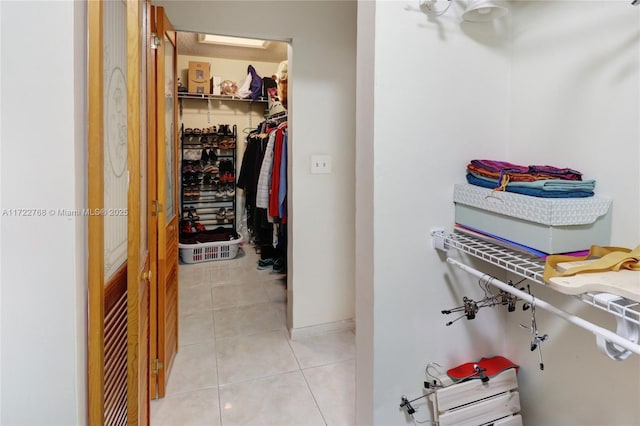 walk in closet featuring light tile patterned floors