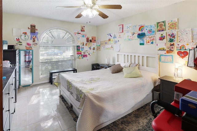 bedroom featuring ceiling fan and light tile patterned flooring