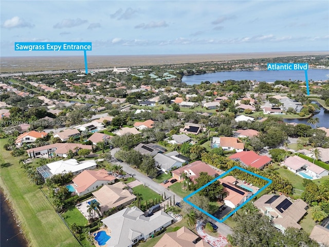 birds eye view of property featuring a water view