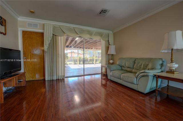 living room with ornamental molding and dark hardwood / wood-style flooring