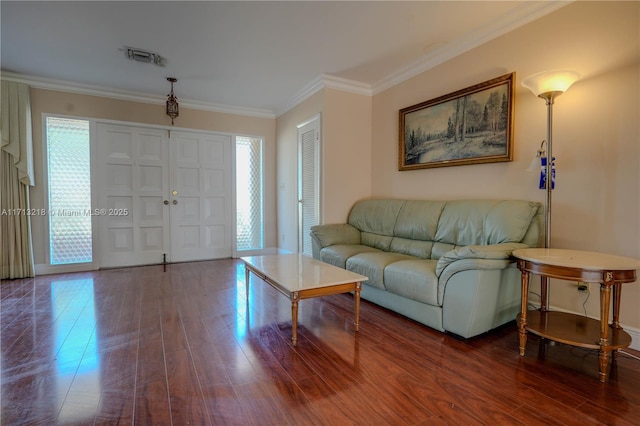 living room featuring crown molding and hardwood / wood-style flooring