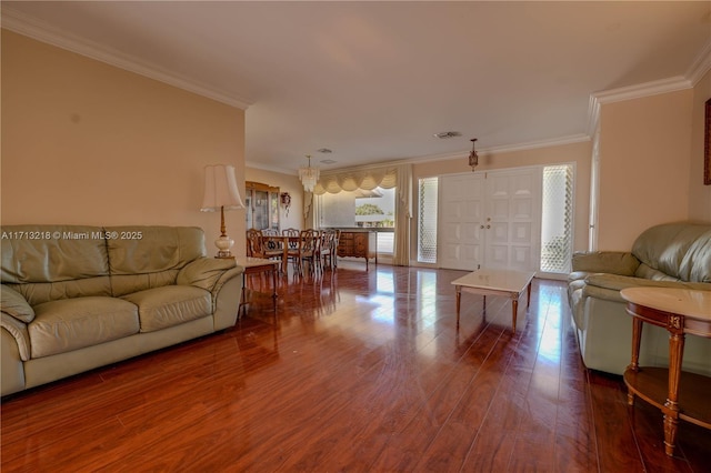 living room with ornamental molding and hardwood / wood-style floors