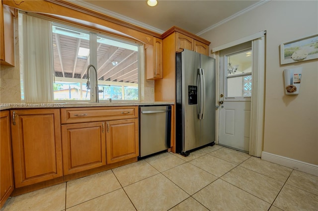 kitchen featuring stainless steel appliances, tasteful backsplash, light tile patterned flooring, ornamental molding, and sink