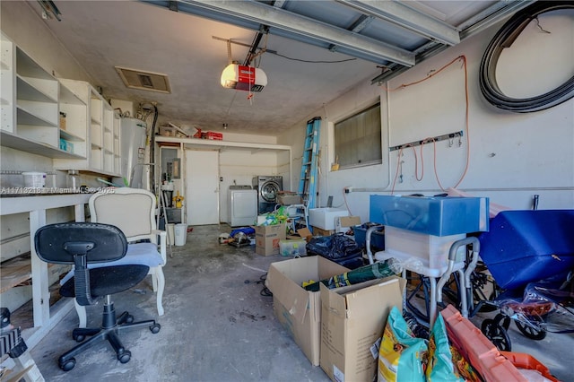 garage with washer and dryer, water heater, and a garage door opener