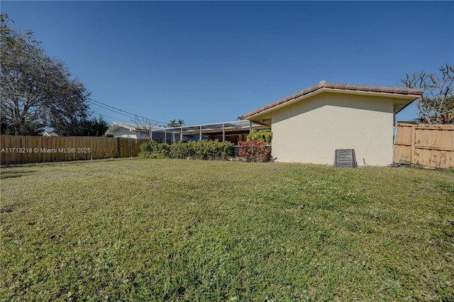 view of yard featuring a lanai