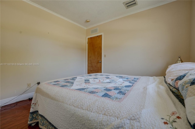 bedroom featuring wood-type flooring and crown molding