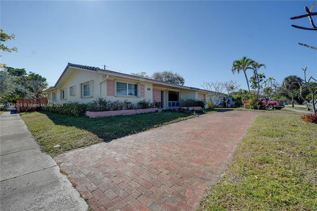 ranch-style house with a front yard