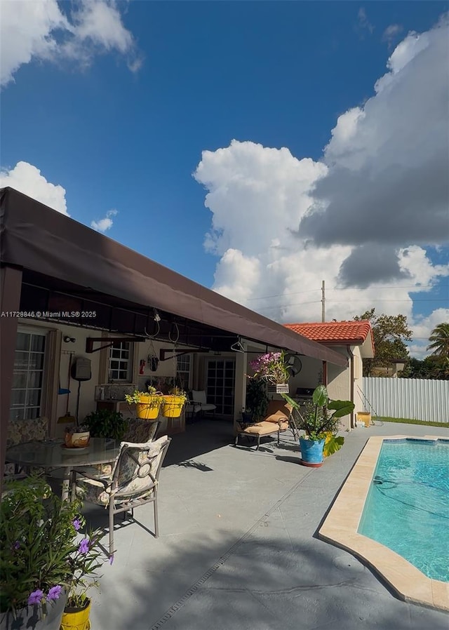 view of swimming pool with a patio area