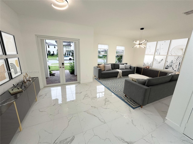 living room with french doors and an inviting chandelier