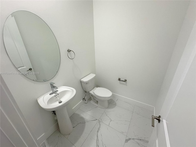 bathroom featuring toilet