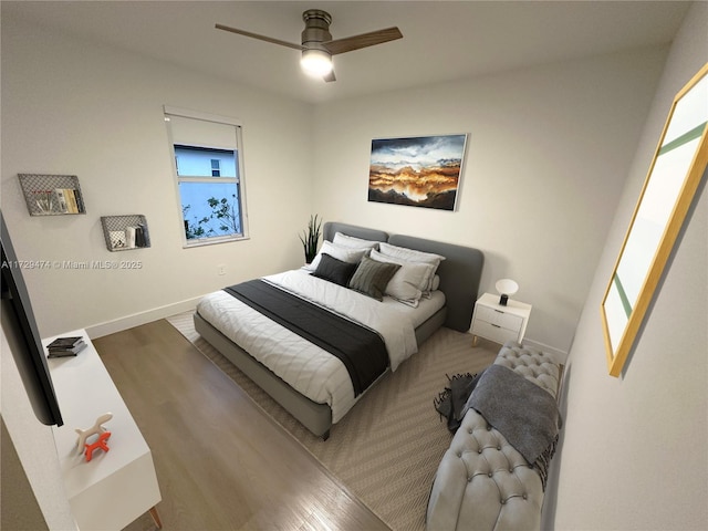 bedroom featuring ceiling fan and hardwood / wood-style floors