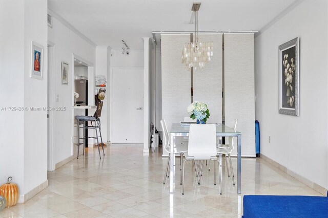 300 Bayview Dr Unit 1503, Sunny Isles Beach, FL 33160 - dining room with a chandelier and ornamental molding