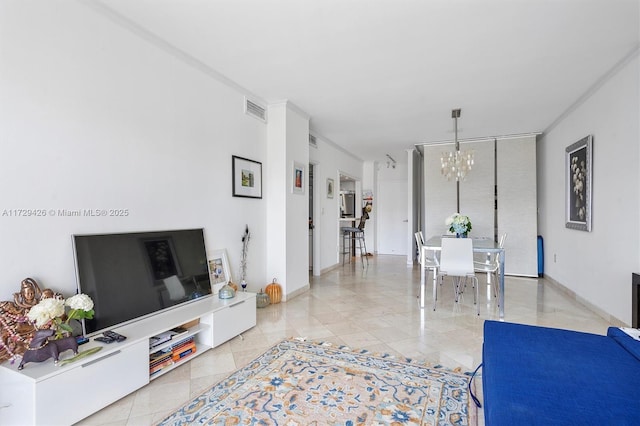 300 Bayview Dr Unit 1503, Sunny Isles Beach, FL 33160 - tiled living room with a chandelier and baseboards