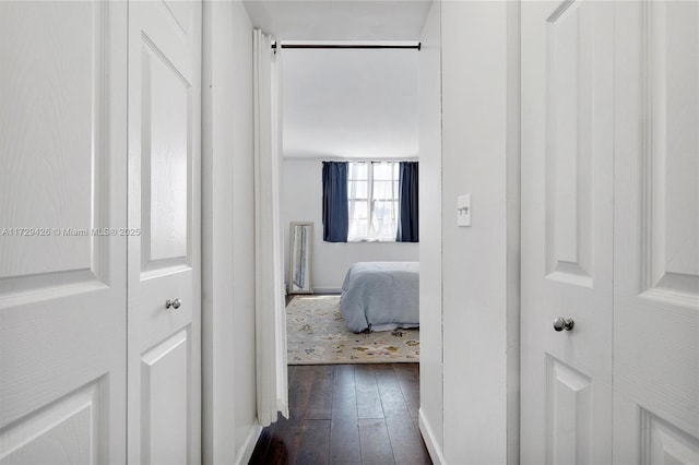 300 Bayview Dr Unit 1503, Sunny Isles Beach, FL 33160 - corridor with dark wood-style floors and baseboards
