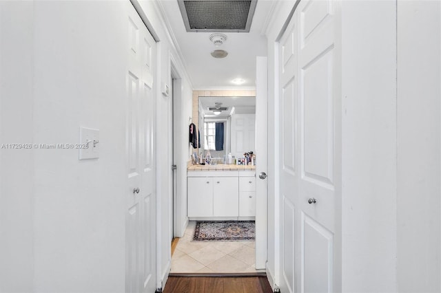 300 Bayview Dr Unit 1503, Sunny Isles Beach, FL 33160 - hall featuring crown molding and dark tile patterned flooring