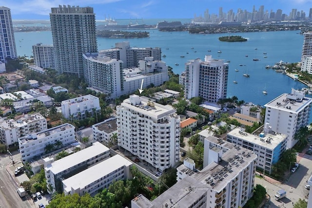 birds eye view of property featuring a water view