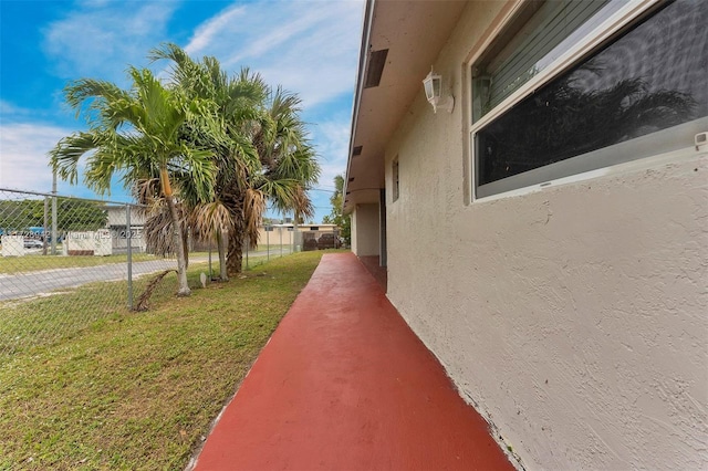 view of property exterior with a yard