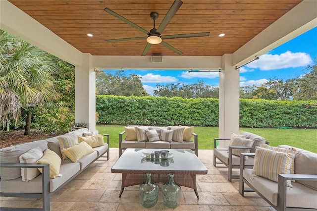 view of patio featuring an outdoor living space and ceiling fan