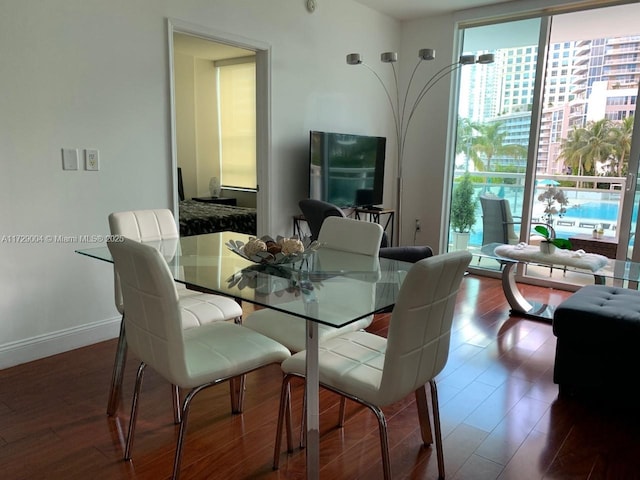 dining area with hardwood / wood-style flooring