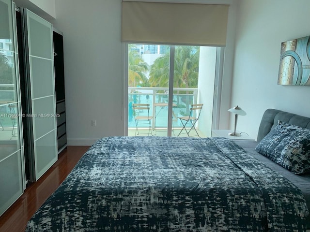 bedroom featuring dark hardwood / wood-style flooring