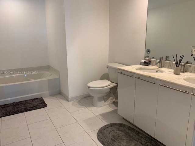 bathroom with a washtub, toilet, and vanity