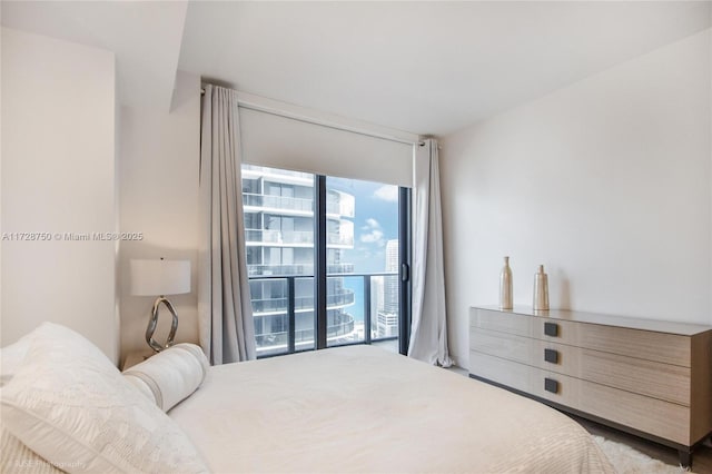 bedroom with floor to ceiling windows