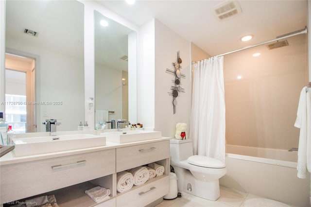 full bathroom featuring toilet, vanity, shower / tub combo with curtain, and tile patterned floors