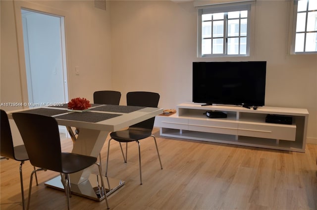 dining room with light wood-type flooring