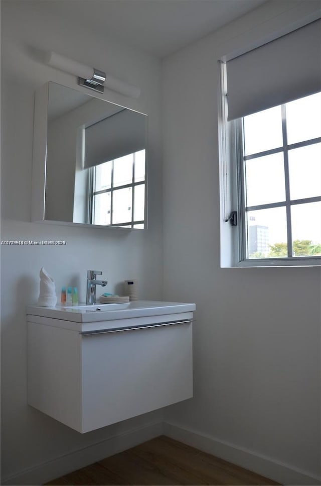 bathroom featuring vanity and wood-type flooring