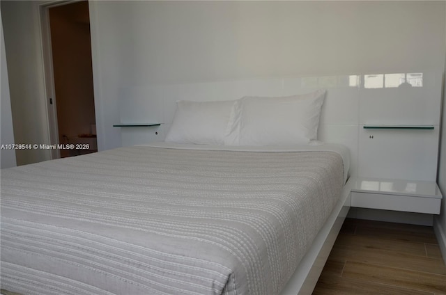 bedroom with wood-type flooring