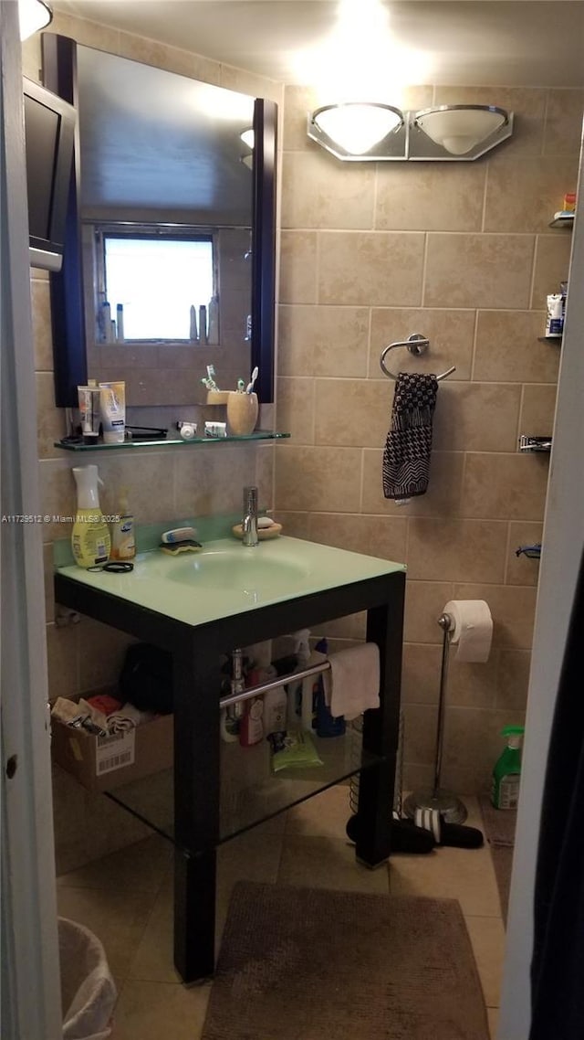 bathroom featuring sink, tile walls, and tile patterned floors