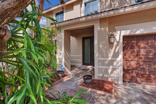 property entrance featuring a garage