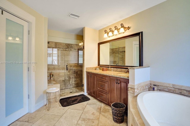 bathroom featuring plus walk in shower and vanity