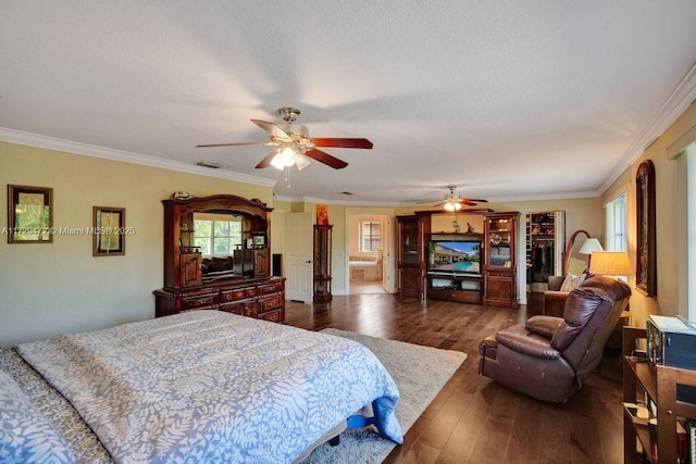 bedroom with dark wood-type flooring, ornamental molding, multiple windows, and ceiling fan