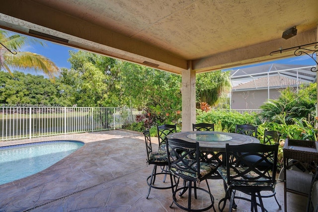 view of patio with a fenced in pool