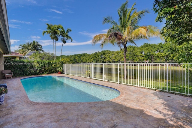 view of swimming pool featuring a patio