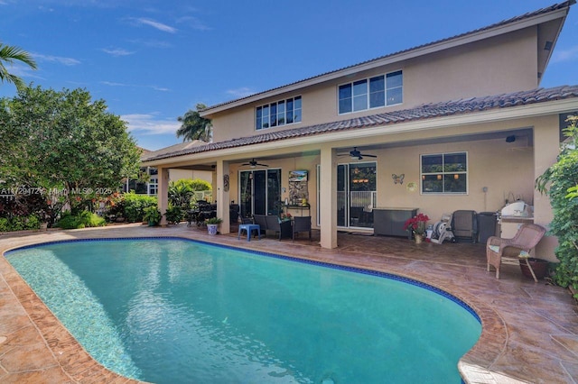 view of pool featuring ceiling fan and a patio area