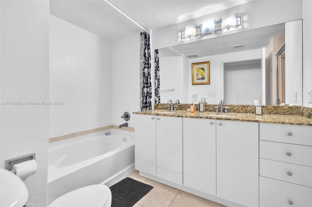 full bathroom with toilet, vanity, tile patterned flooring, a textured ceiling, and shower with separate bathtub