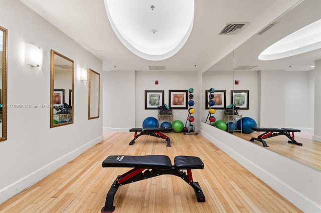 workout room with hardwood / wood-style flooring