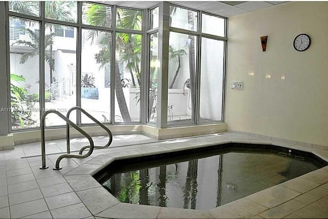 view of swimming pool with an indoor in ground hot tub