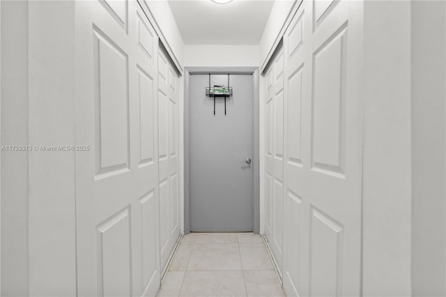 hallway with light tile patterned flooring