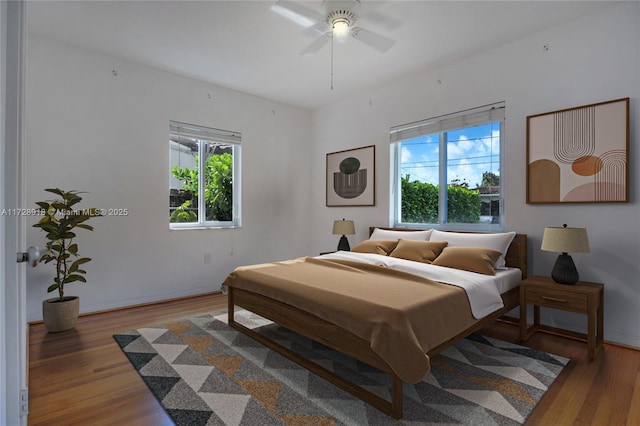 bedroom featuring hardwood / wood-style flooring and ceiling fan